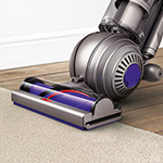The Dyson Small Ball vacuum has stiff nylon bristles for carpets, soft carbon fibre filaments for hard floors.
