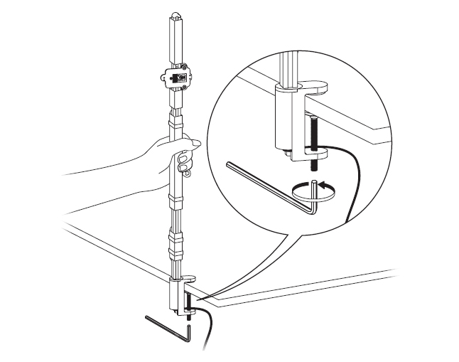 diagram showing how to fix the clamp to a desk